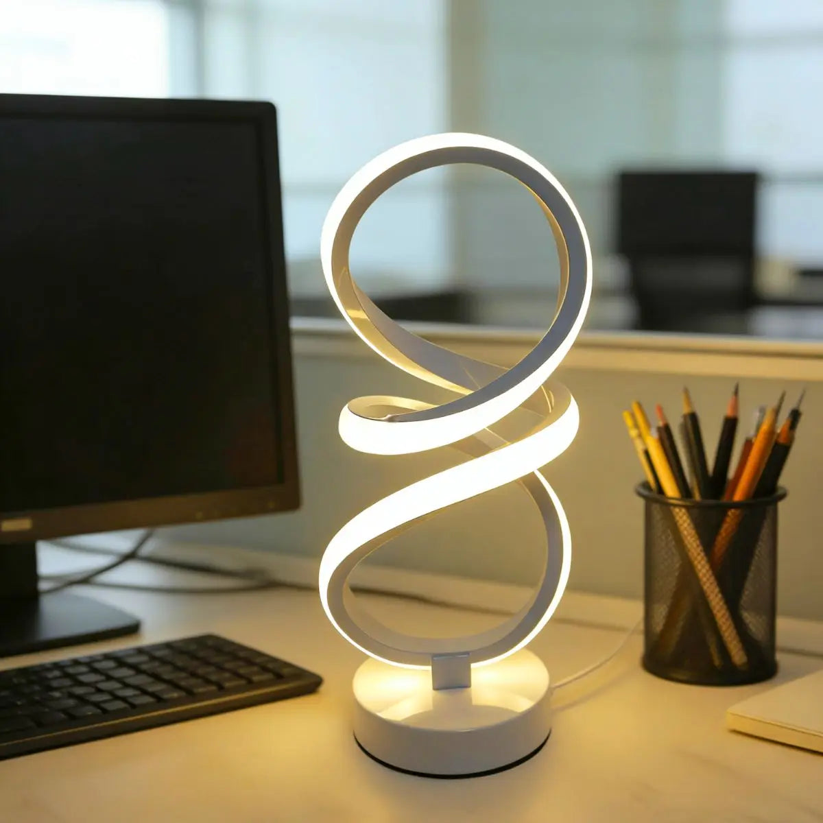 Loop Lamp in white on a desk
