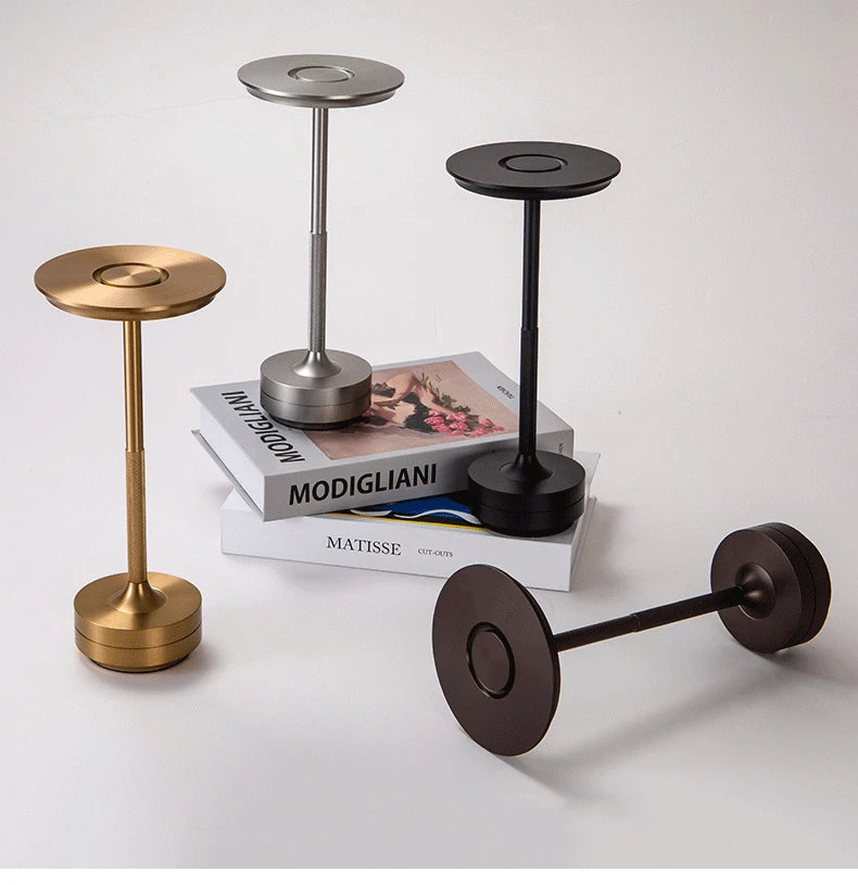 Orbit lamps in gold, silver and black