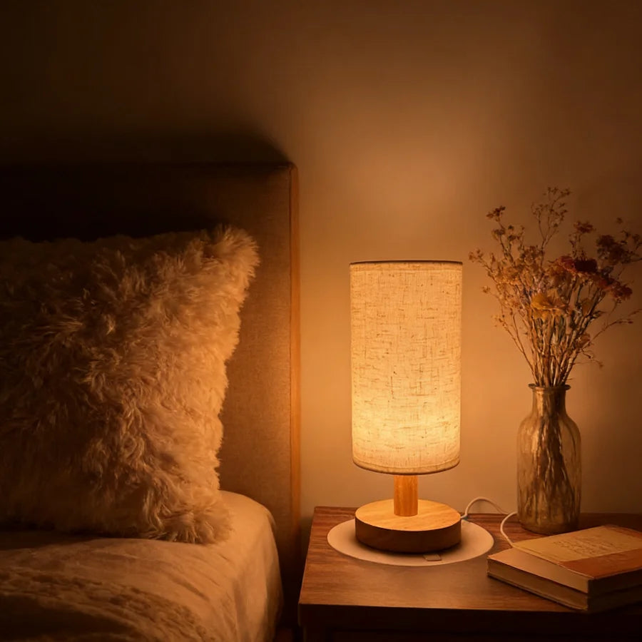 Nook Lamp glowing warm on a bedside table